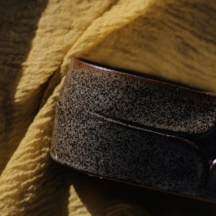 Clean-burning soy candle in rustic green ceramic oval vessel, handcrafted by Concrete Poppy Design, Denver
