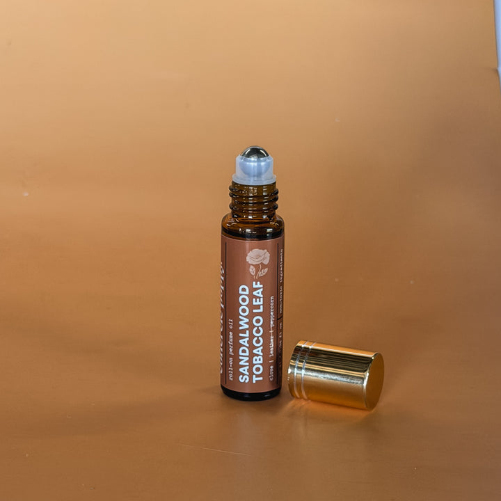 Sandalwood tobacco leaf roll-on perfume oil by Concrete Poppy Design, handcrafted clean fragrance with leather and clove