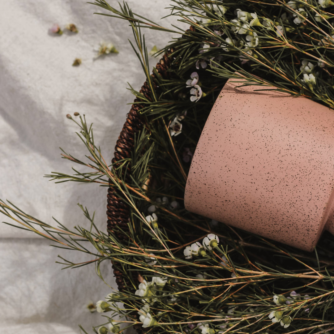 Hali 22 oz dusty rose ceramic soy candle handmade in Denver, non-toxic clean-burning with wildflower seeds — housewarming gift