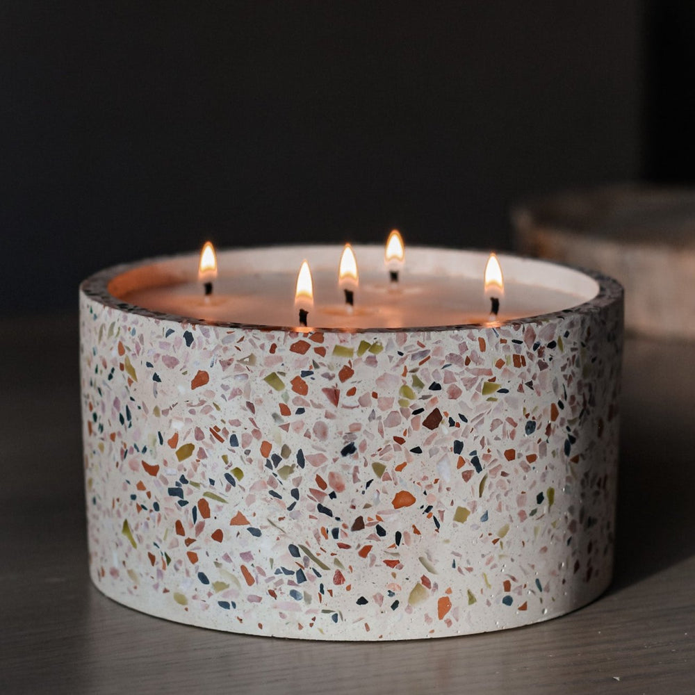 Large handcrafted non-toxic soy candle in multi-colored terrazzo in white concrete vessel, luxury candle with wildflower seeds
