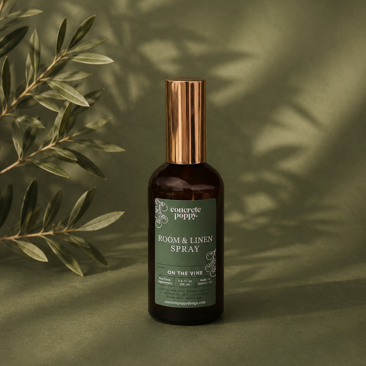 Room and linen spray bottle with a green label on a green background